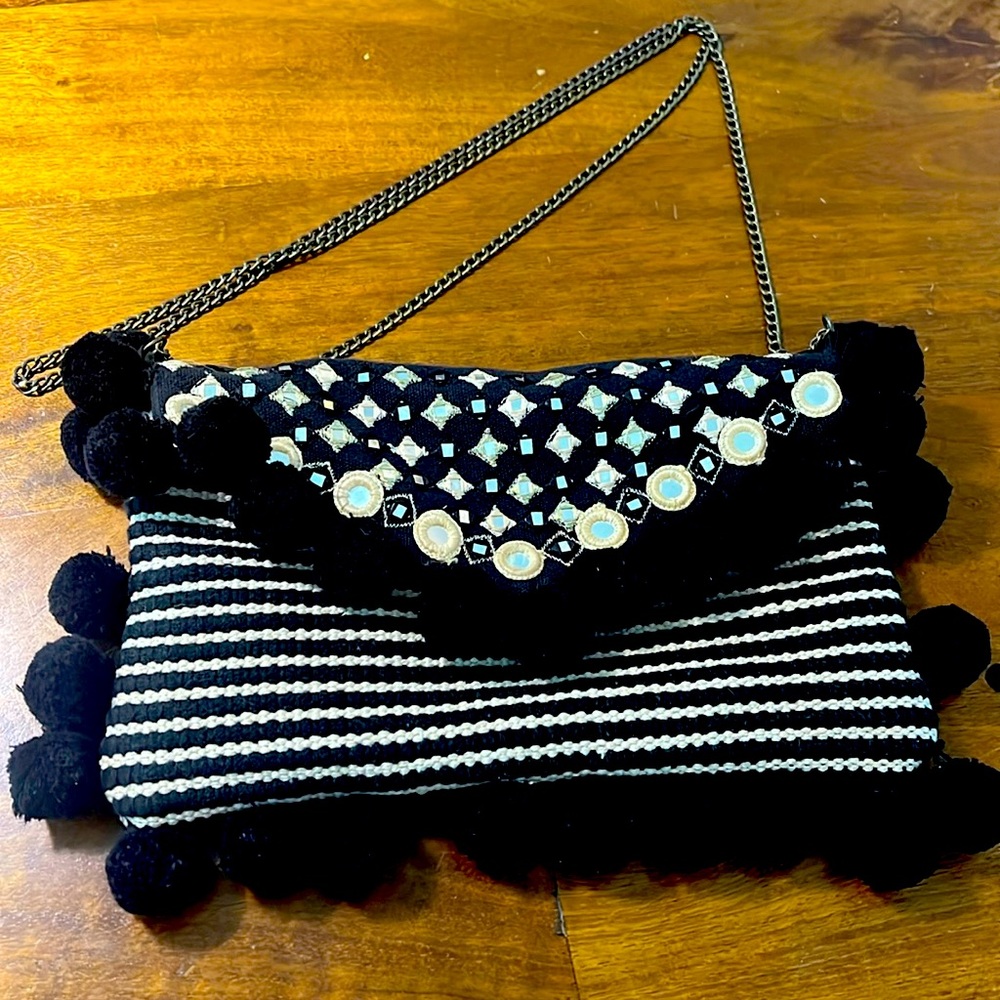 Workd Market Boho Crossbody bag with metal chain.